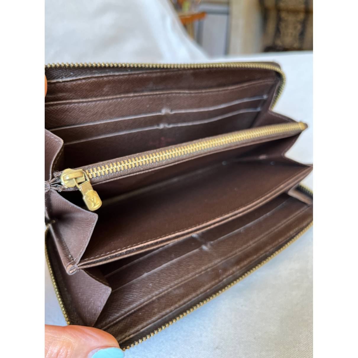 brown louis vuitton wallet inside