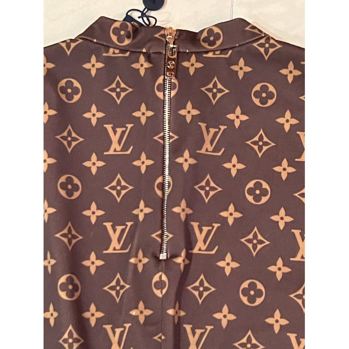 Mid-length dress Louis Vuitton Brown size M International in Synthetic -  24924586