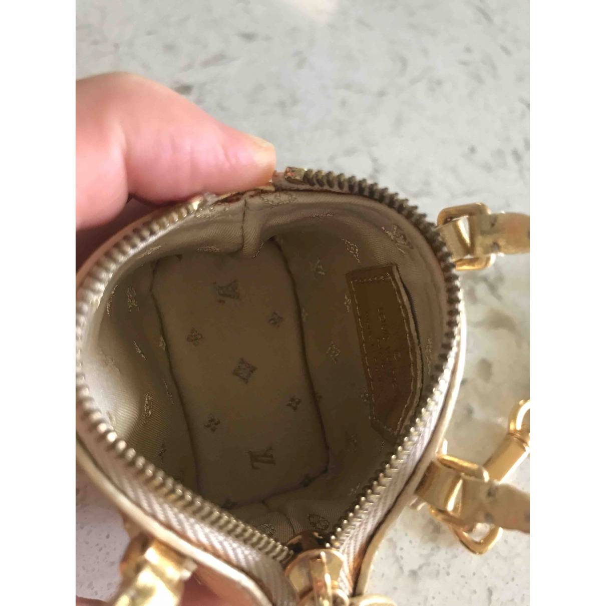 Leather bag charm Louis Vuitton Gold in Leather - 11931814