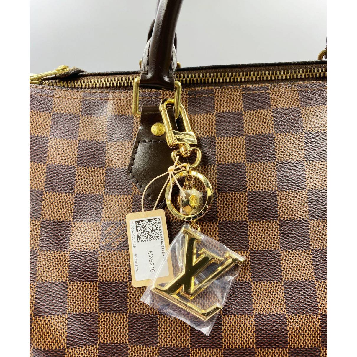 Louis Vuitton Facettes Bag Charm & Key Holder Gold M65216