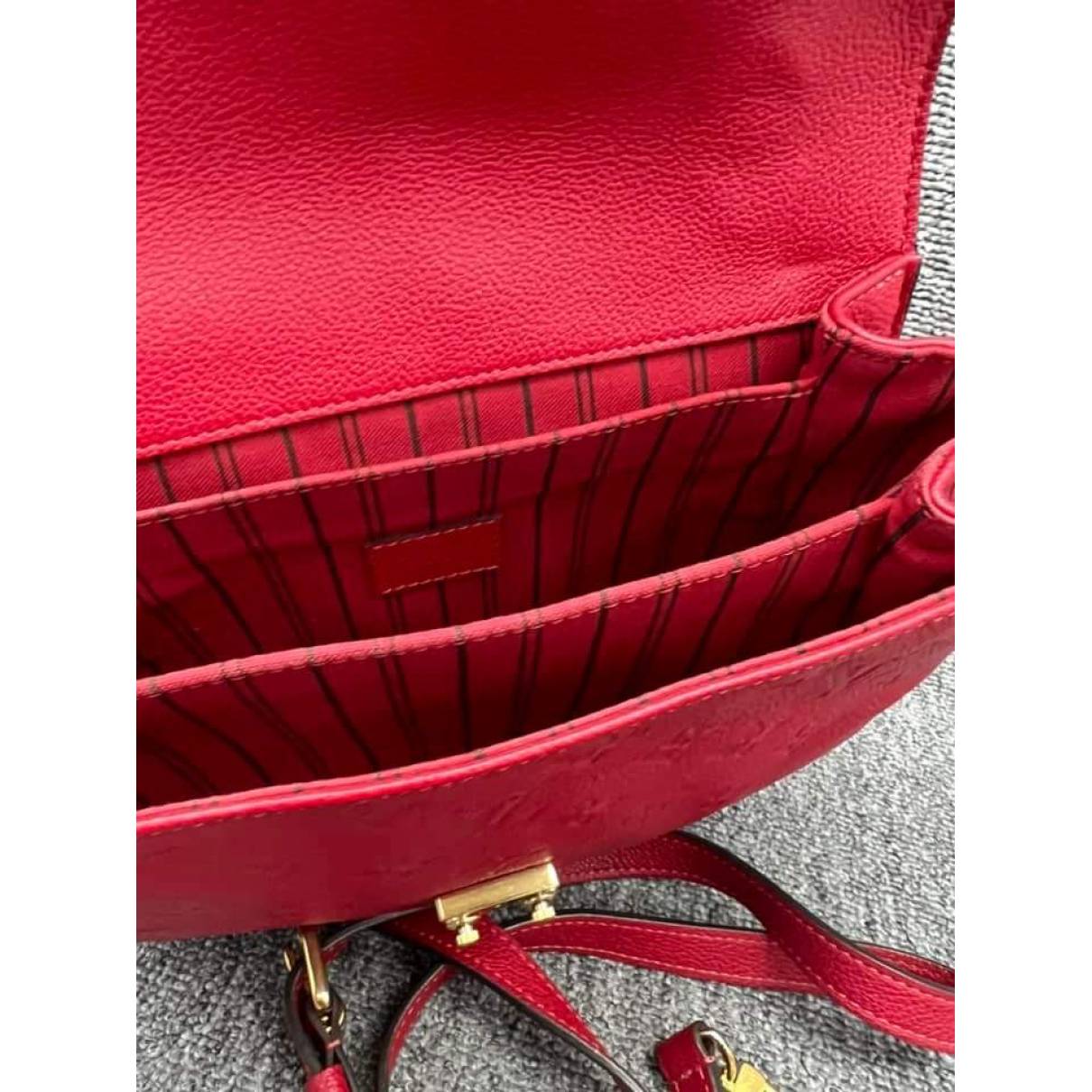 black lv bag with red inside