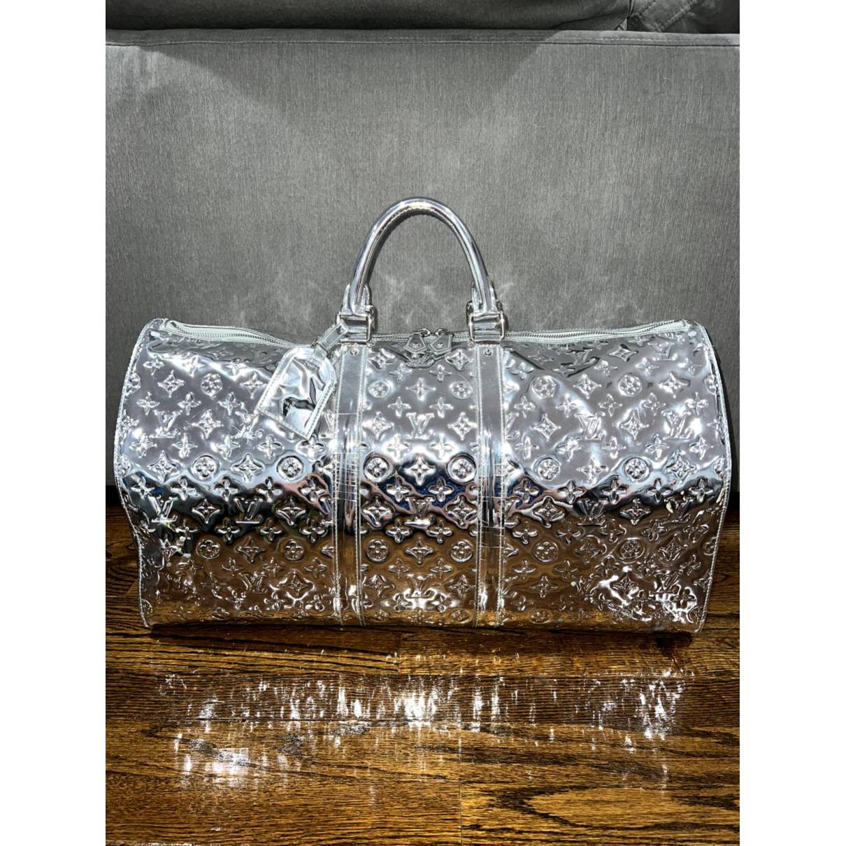 Keepall travel bag Louis Vuitton Silver in Plastic - 23637989