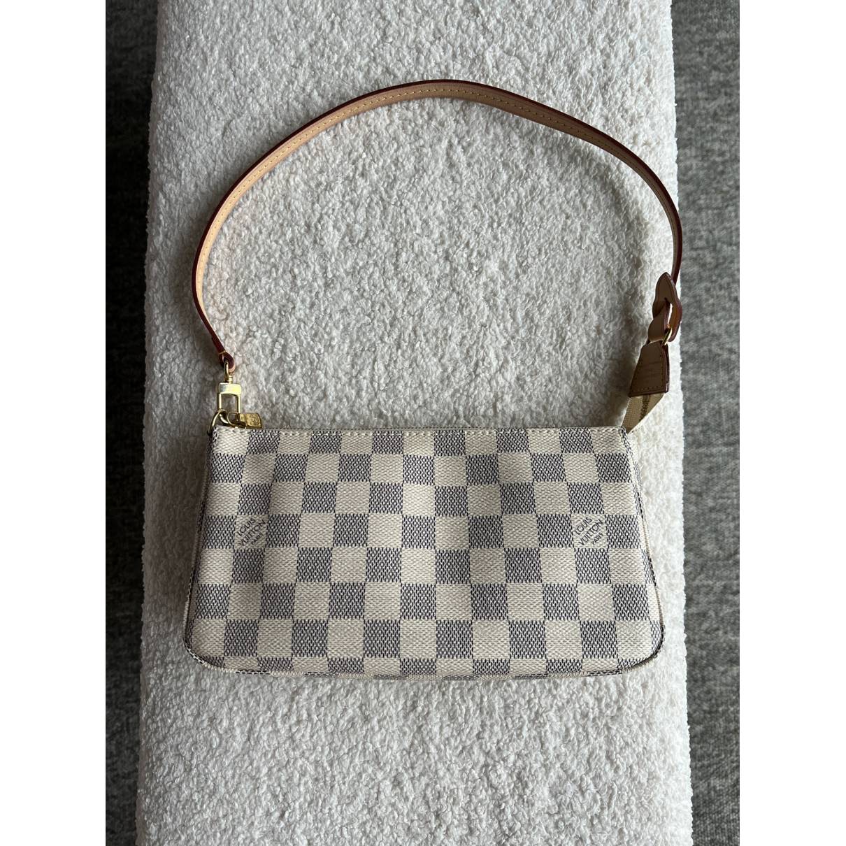 Pochette accessoire leather handbag Louis Vuitton White in Leather