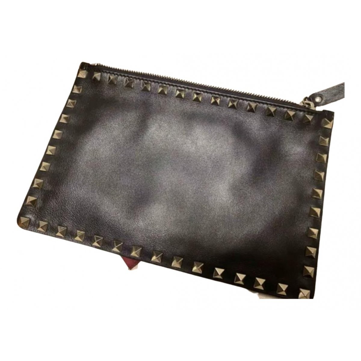 Rockstud leather clutch bag