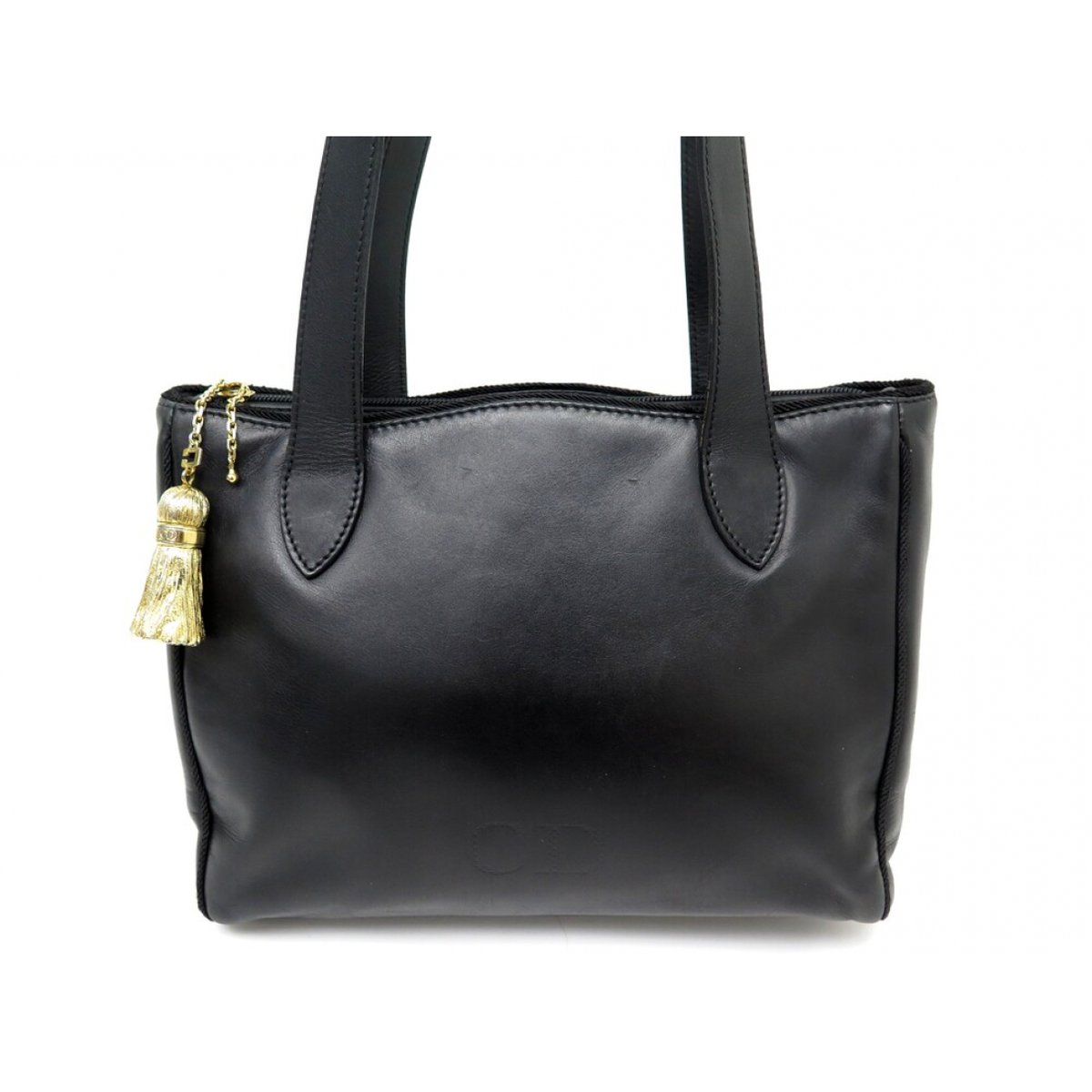 Pompon leather handbag