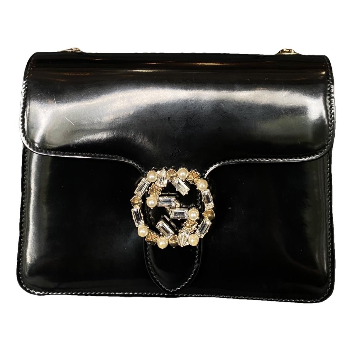 Interlocking patent leather handbag