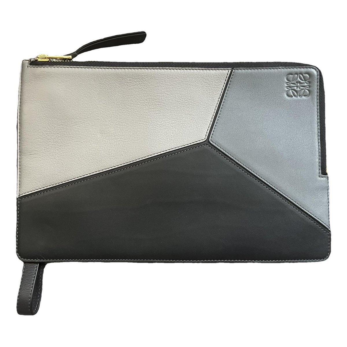 Puzzle leather clutch bag
