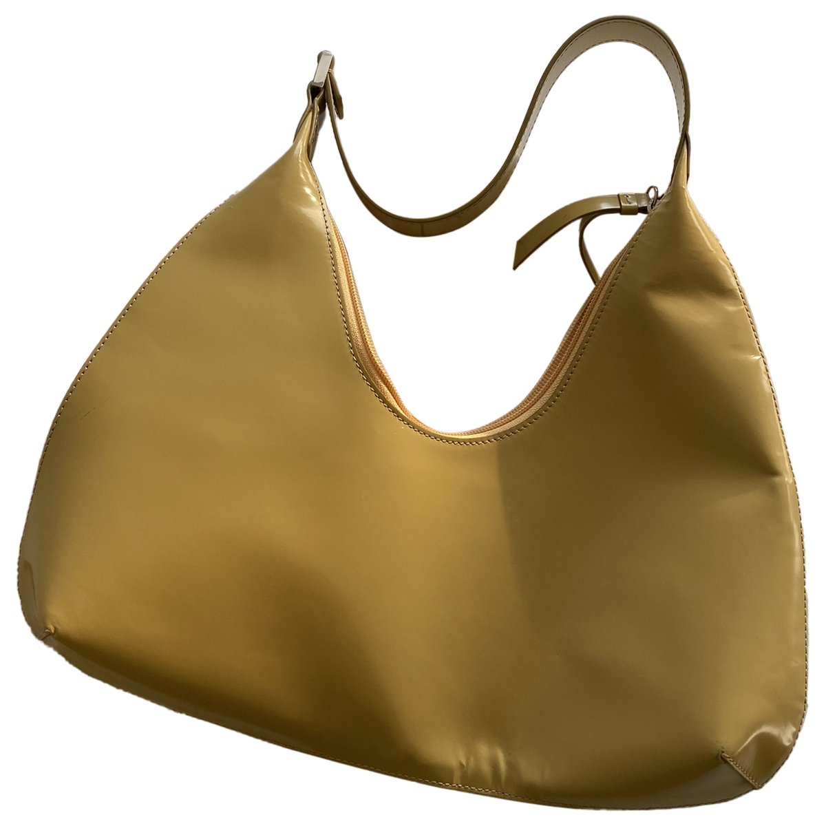 Amber patent leather handbag