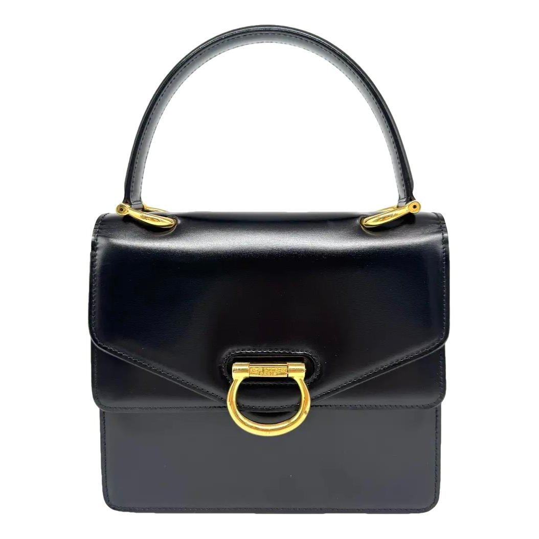 Clasp leather handbag
