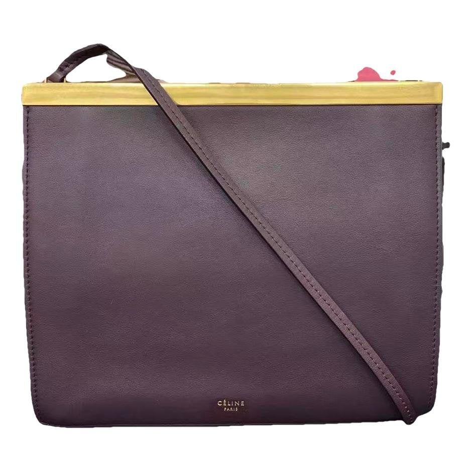 Clasp leather handbag