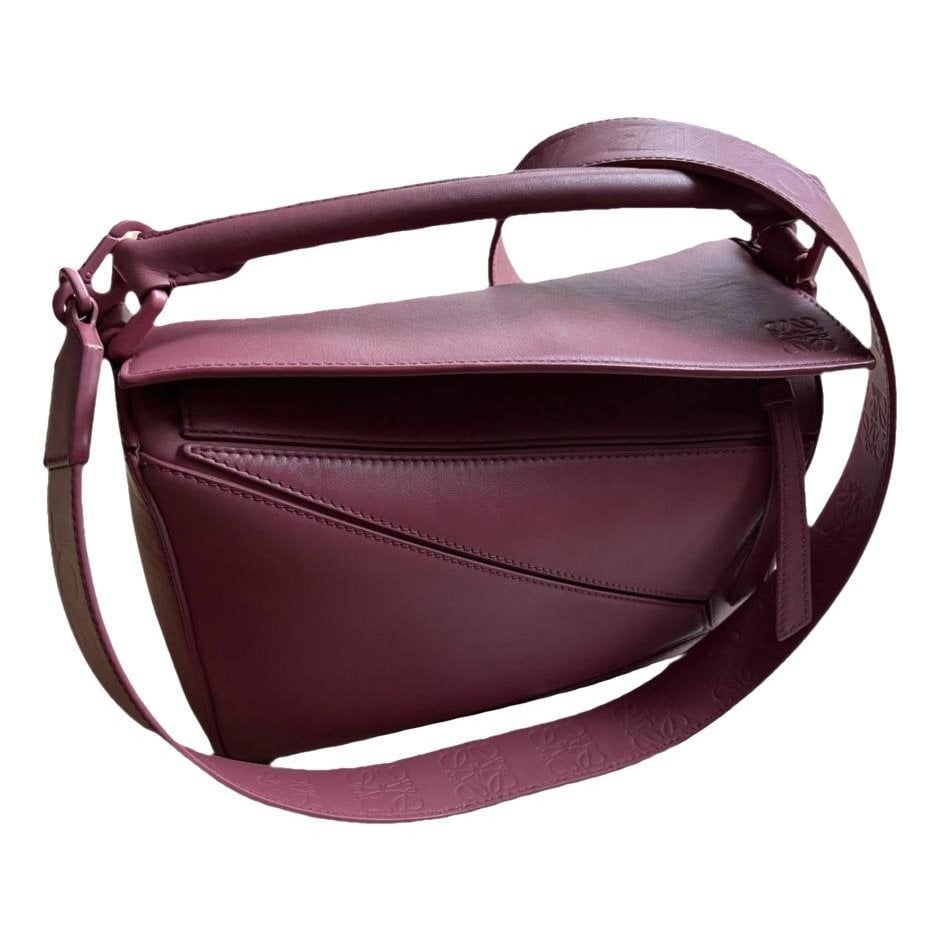 Puzzle leather handbag