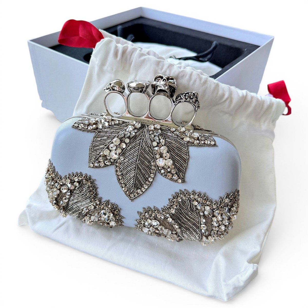 Knuckle leather clutch bag