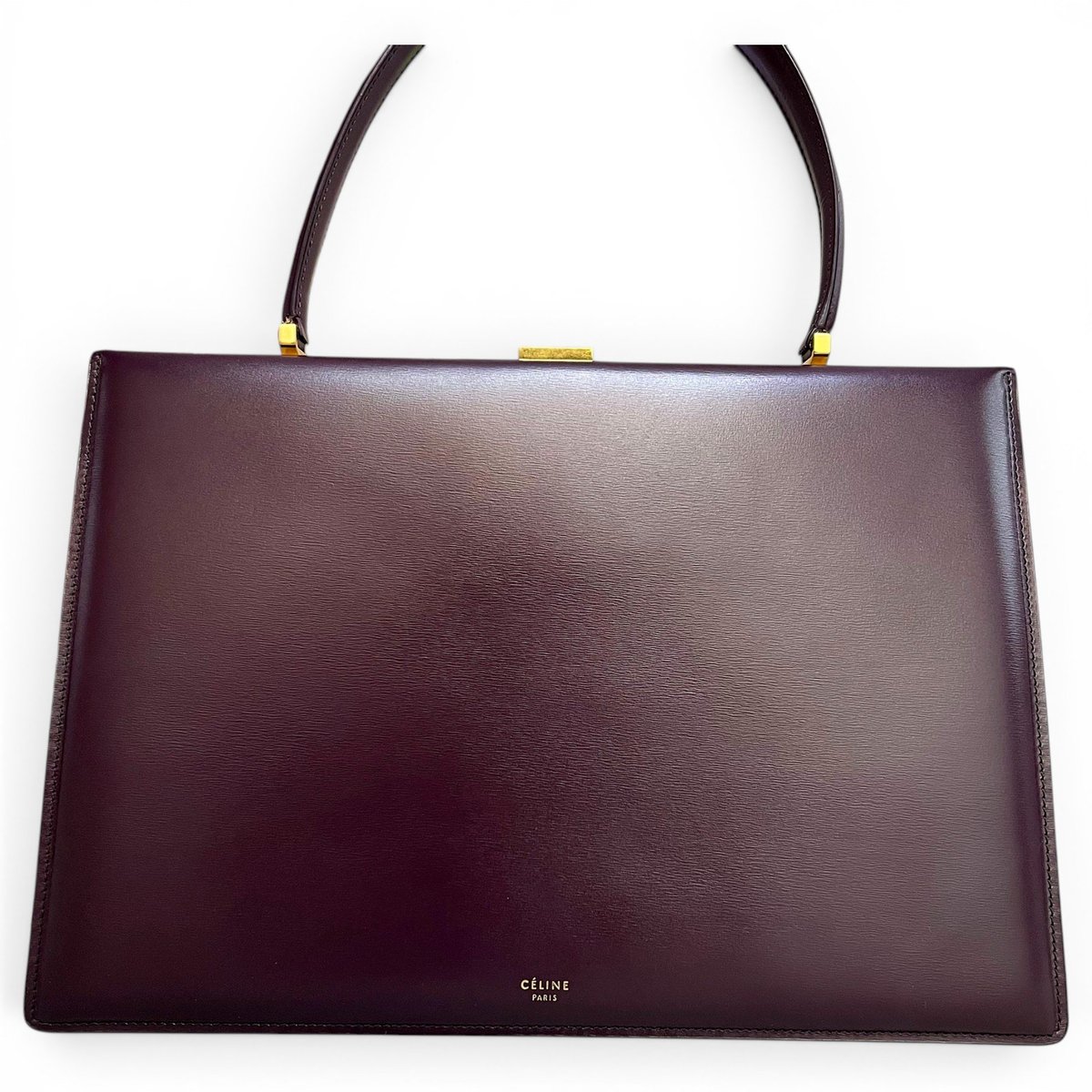 Clasp leather handbag