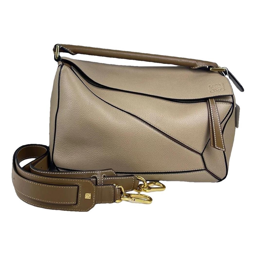 Puzzle leather handbag