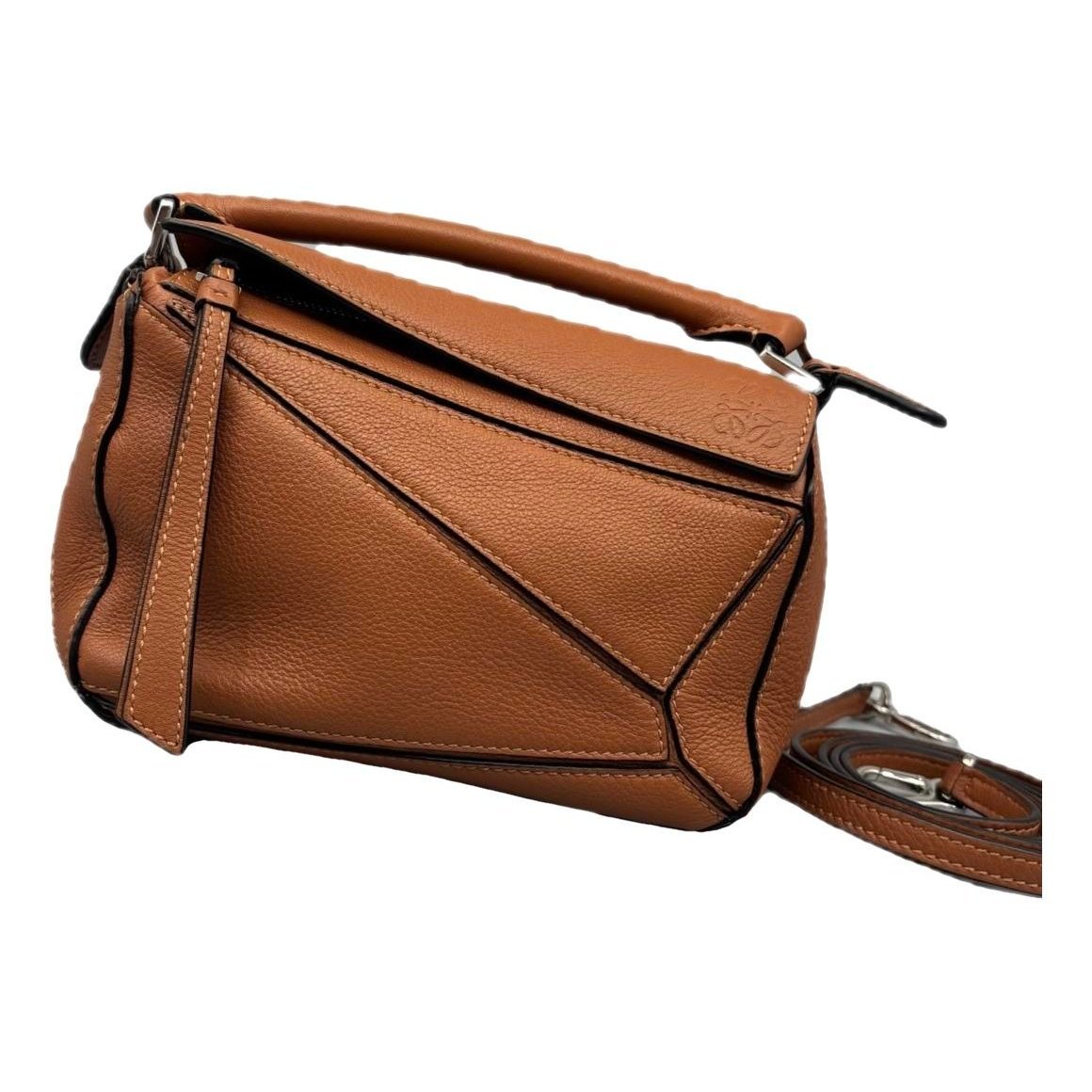 Puzzle leather handbag