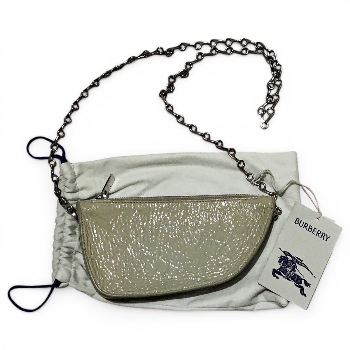 Shield patent leather handbag