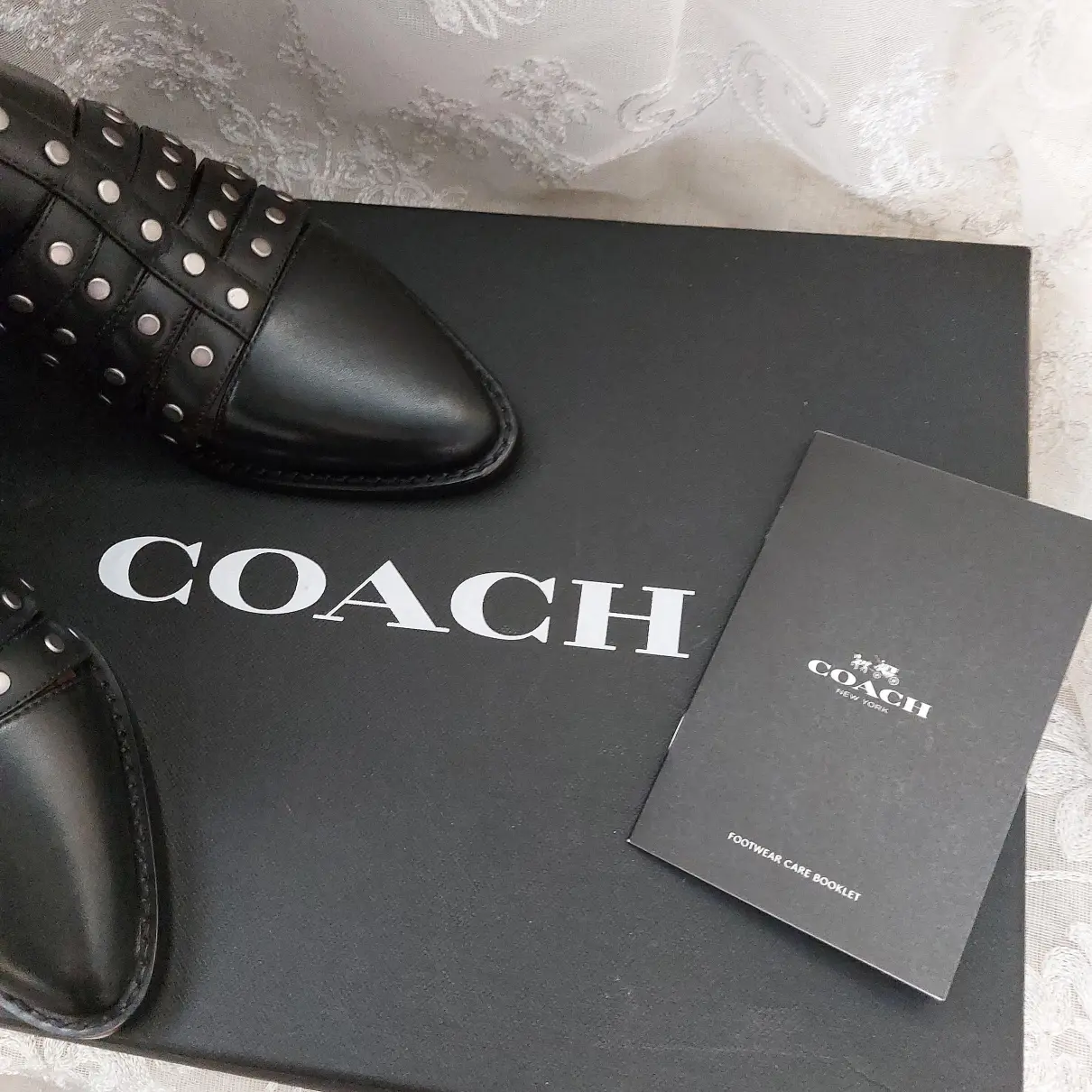 Leather buckled boots Coach