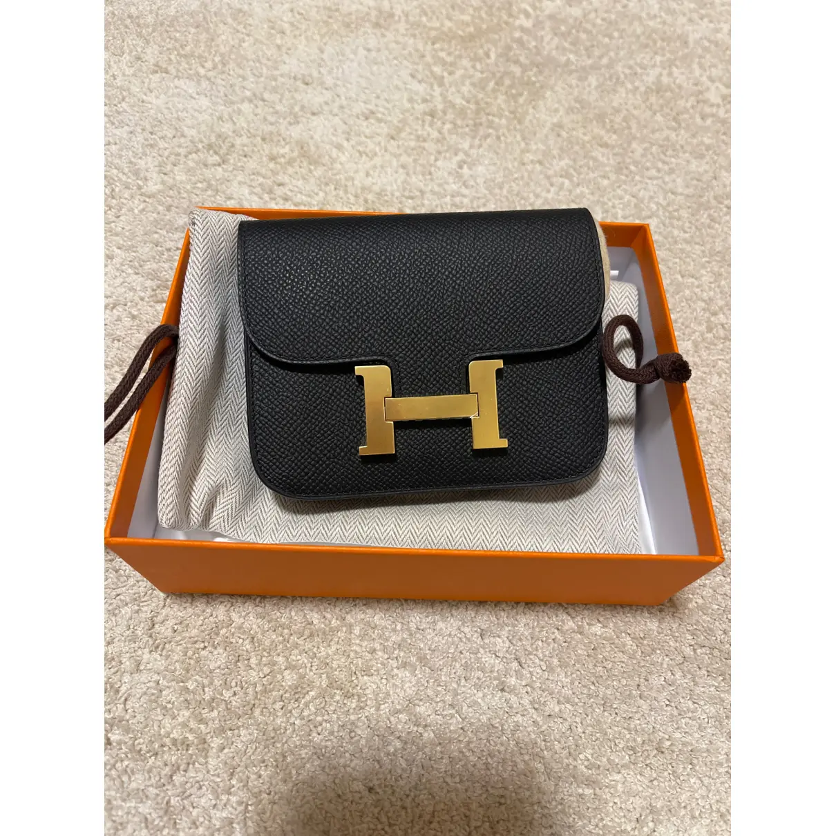 Buy Hermès Constance leather clutch bag online