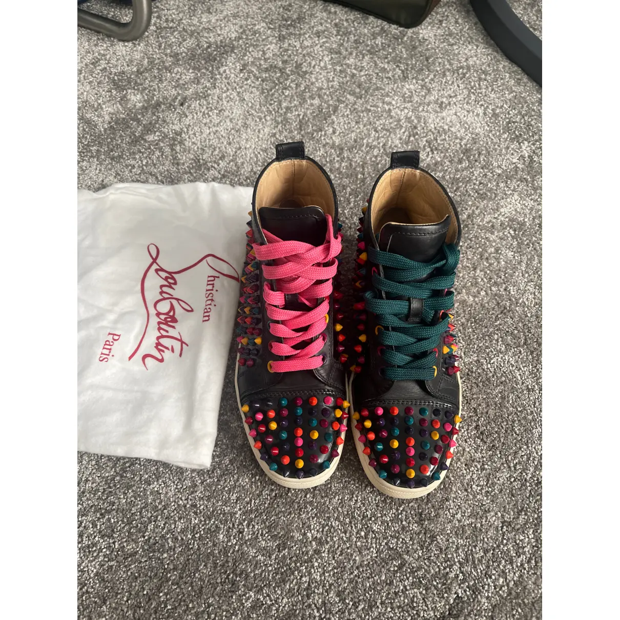 Buy Christian Louboutin Lou Spikes leather trainers online