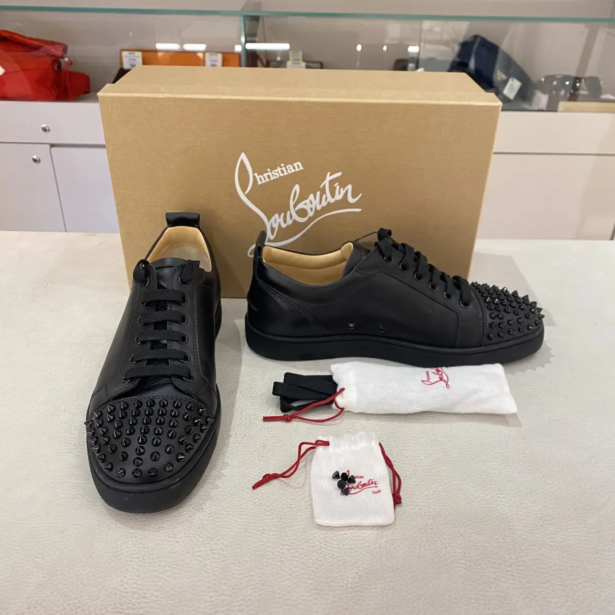 Buy Christian Louboutin Louis junior spike leather low trainers online