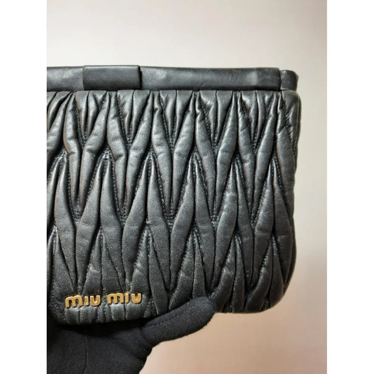 Matelassé leather clutch bag Miu Miu