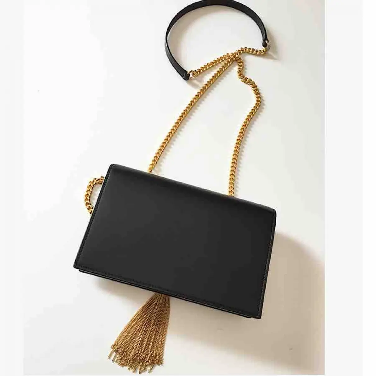 Buy Saint Laurent Pompom Kate leather clutch bag online