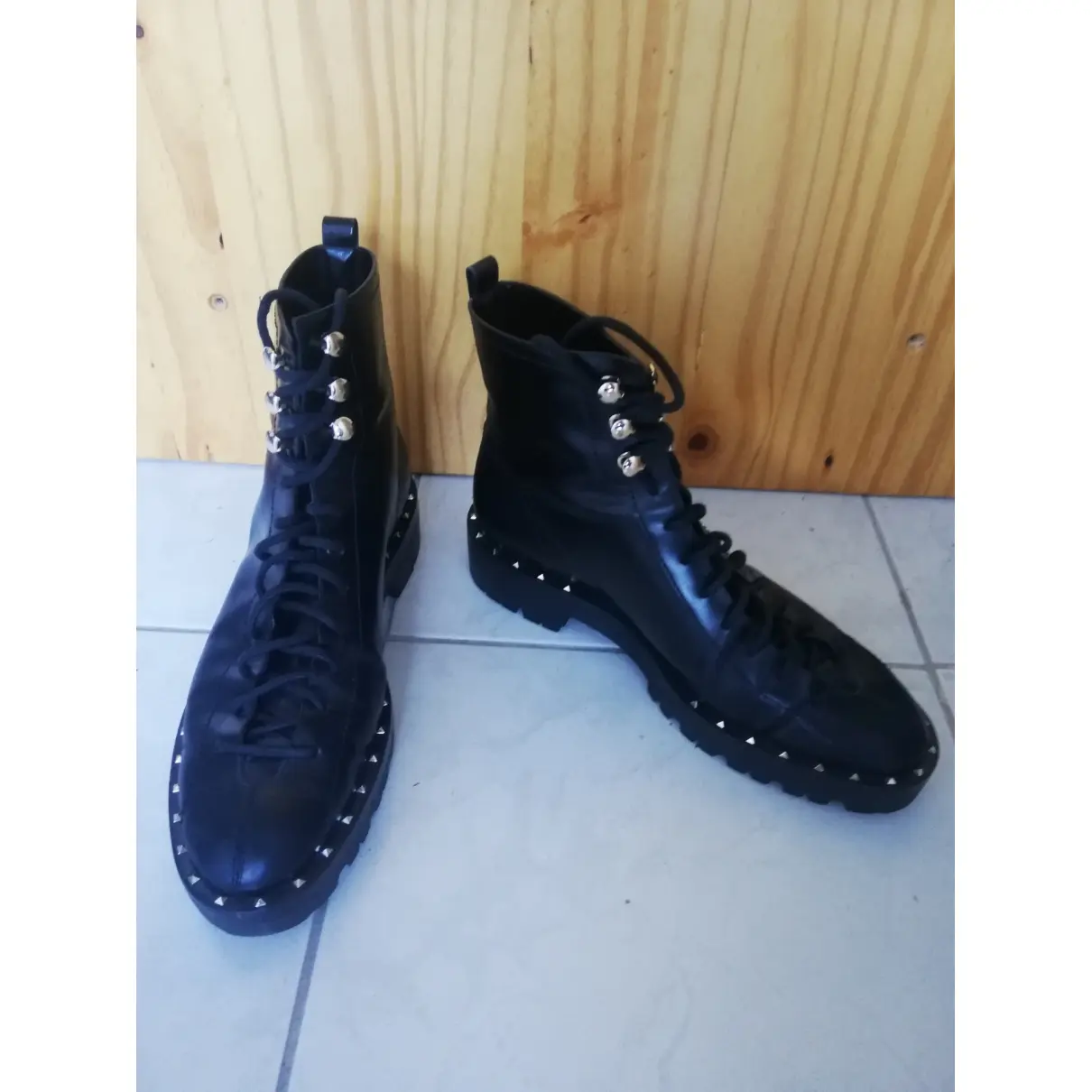 Buy Valentino Garavani Rockstud leather lace up boots online