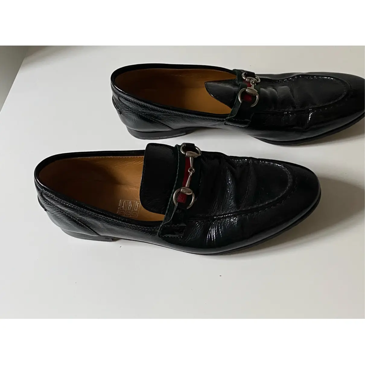 Buy Gucci Brixton patent leather flats online