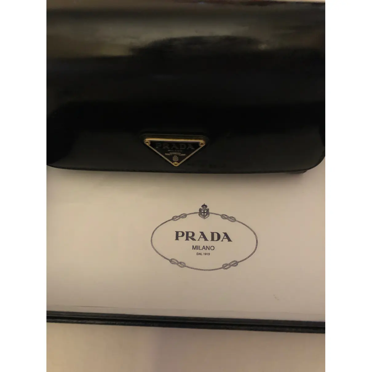 Diagramme patent leather wallet Prada