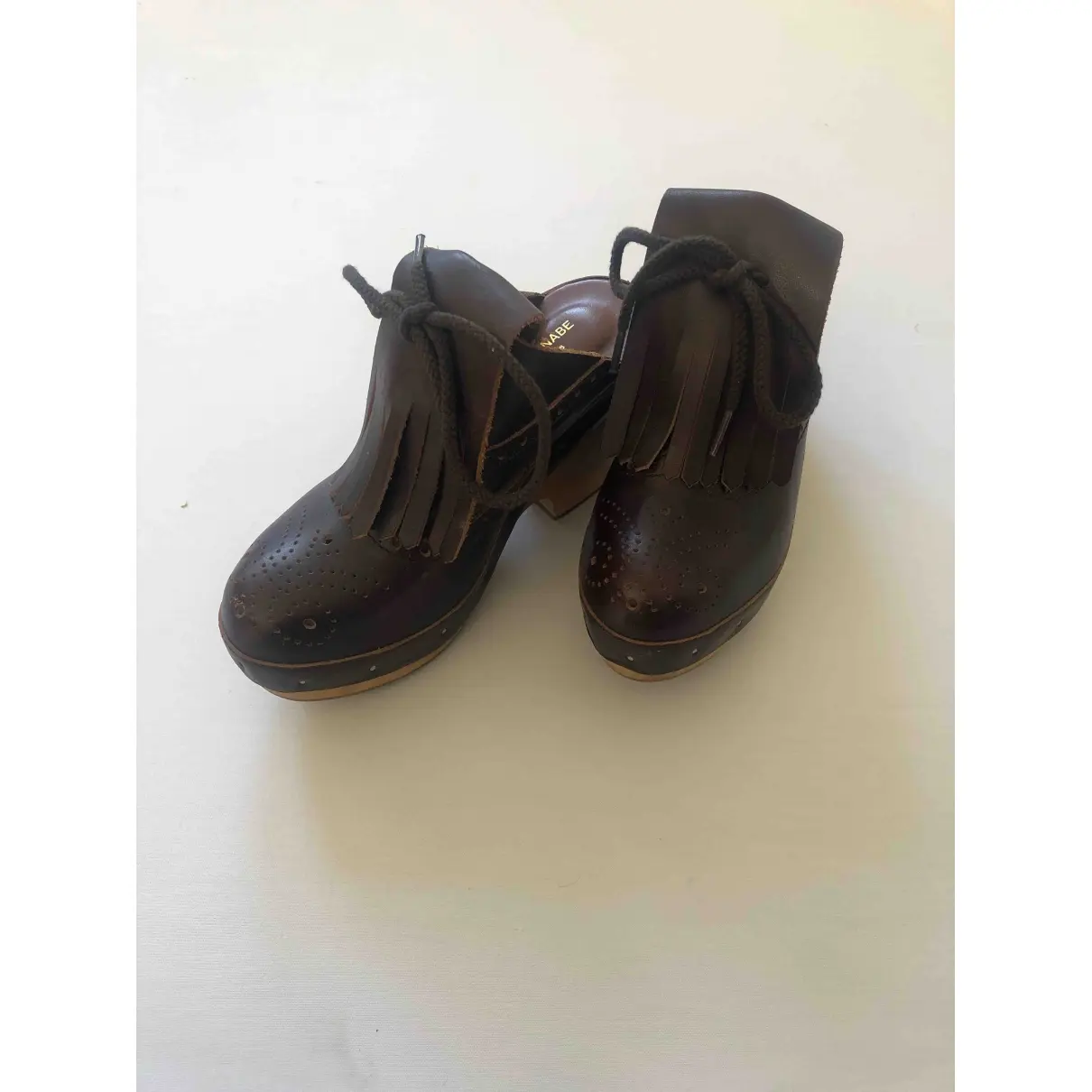 Buy Junya Watanabe Leather mules & clogs online