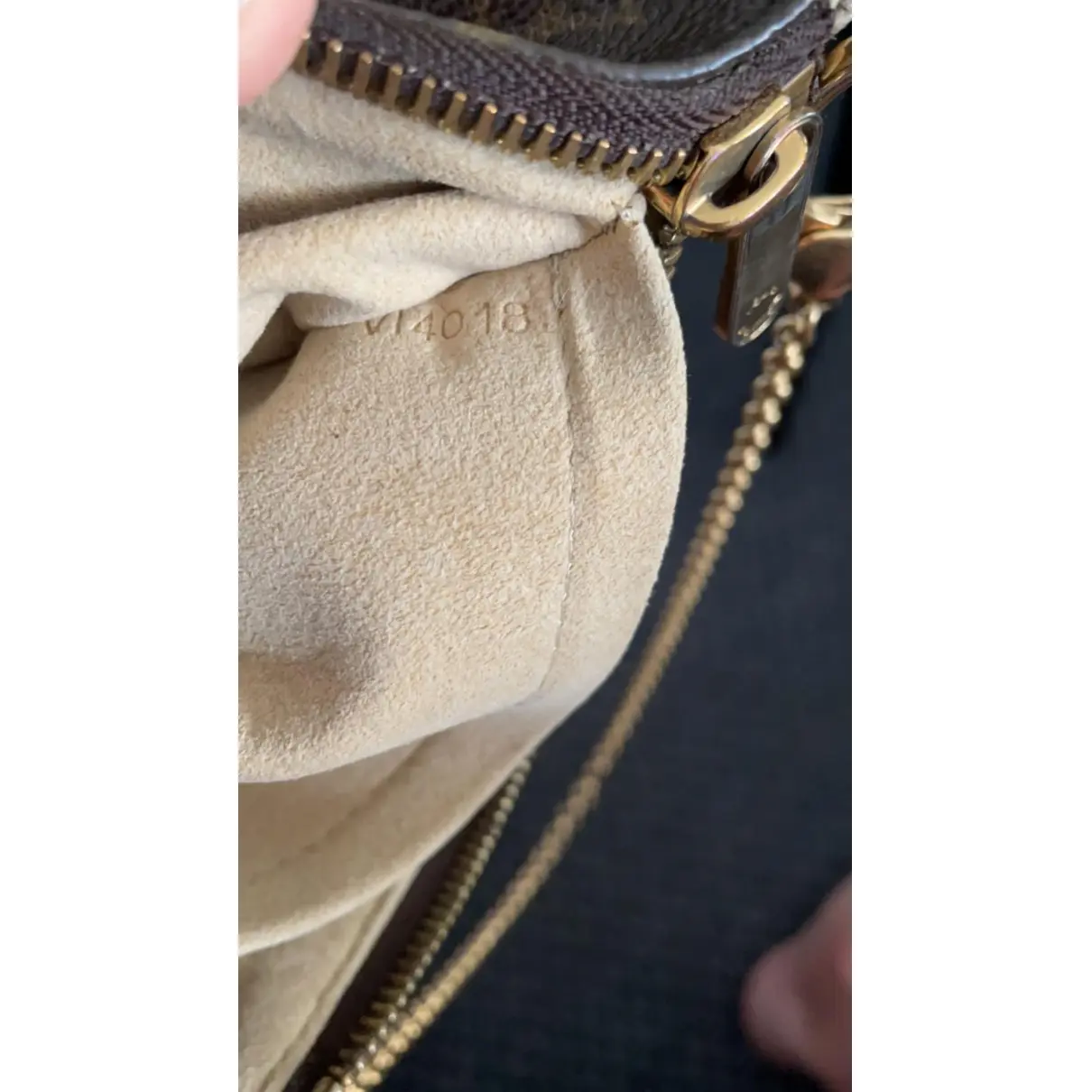 Milla leather clutch bag Louis Vuitton