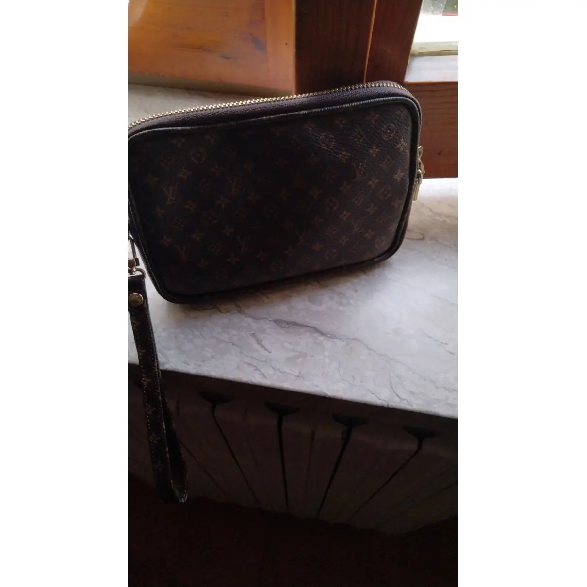 Buy Louis Vuitton Orsay leather clutch bag online