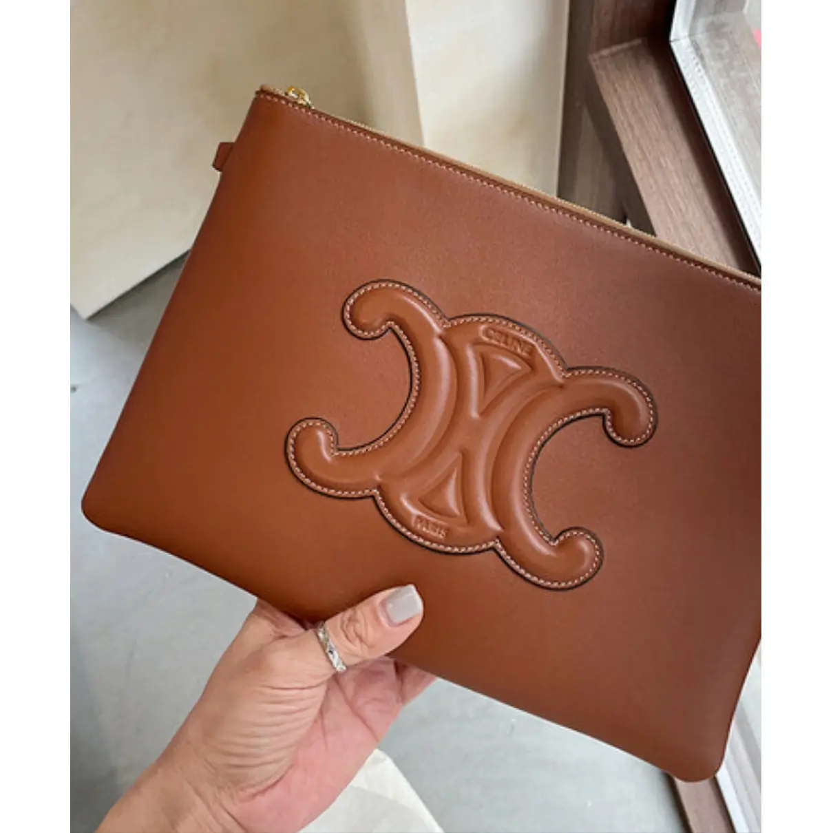 Buy Celine Triomphe leather clutch bag online