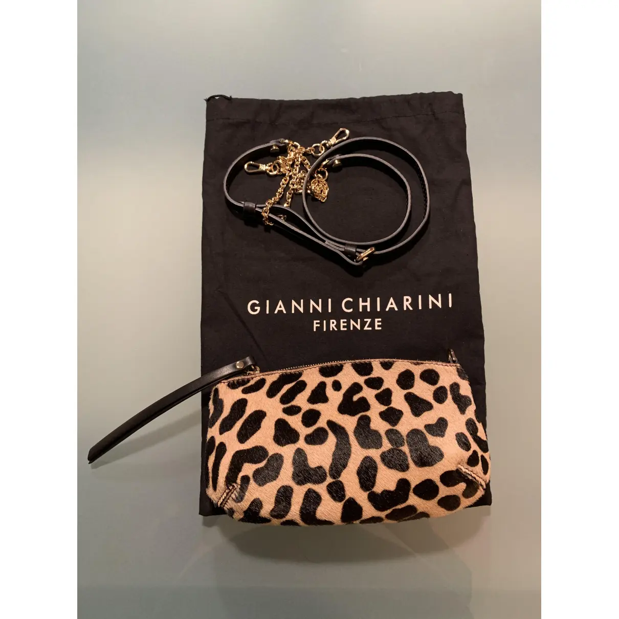 Pony-style calfskin clutch bag Gianni Chiarini
