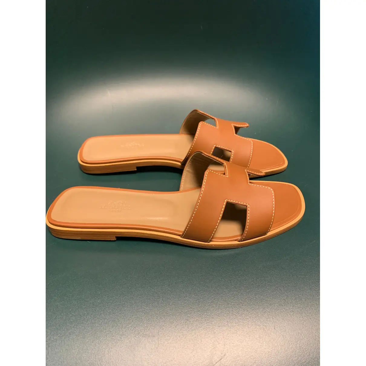 Buy Hermès Oran leather flip flops online