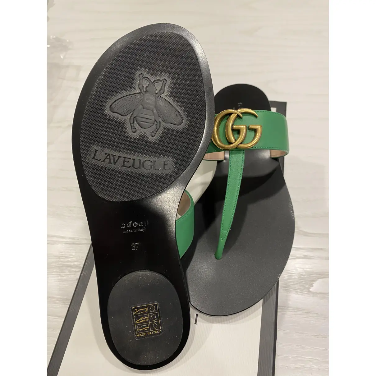 Buy Gucci Double G leather flip flops online