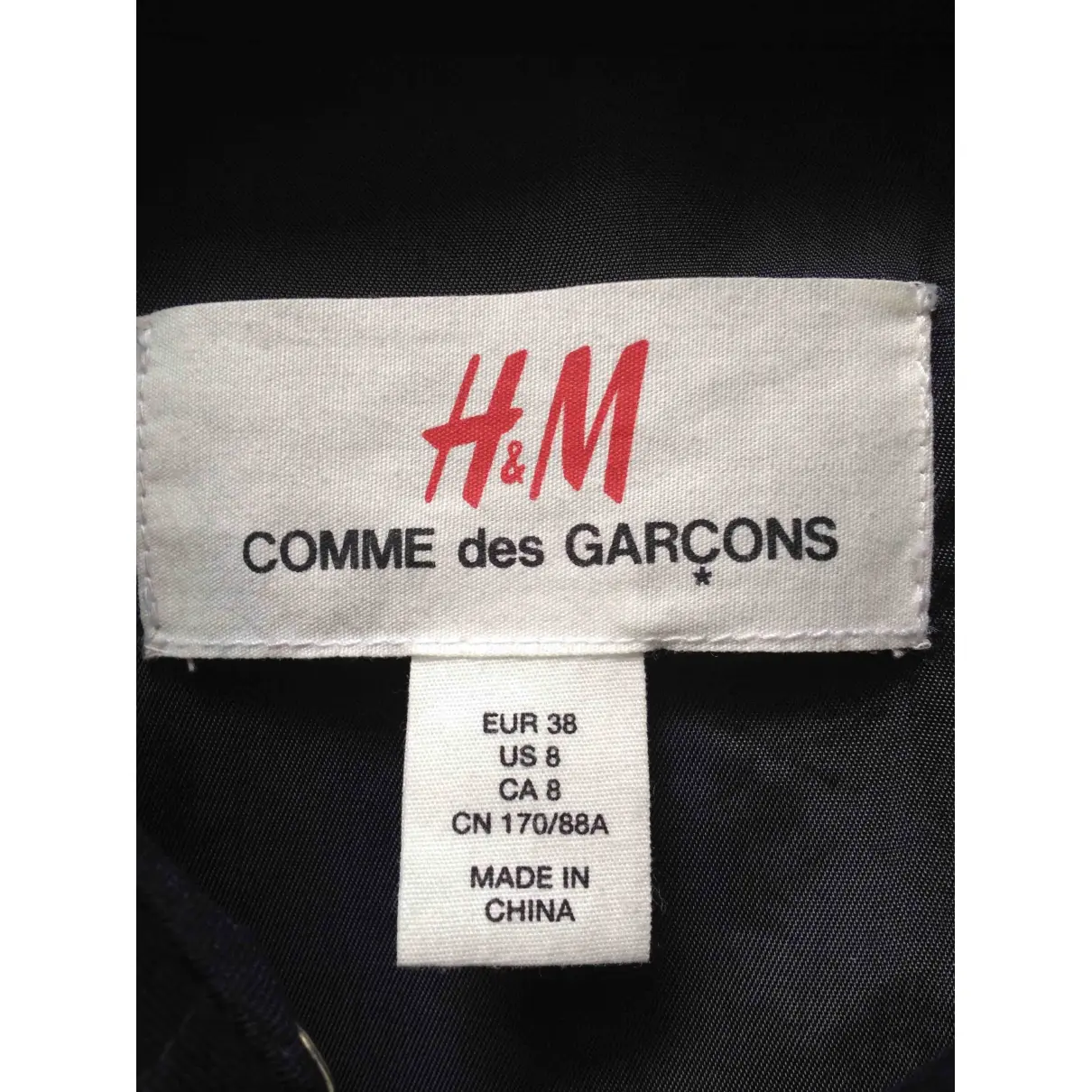 Buy Comme Des Garcons x H&M Trench coat online
