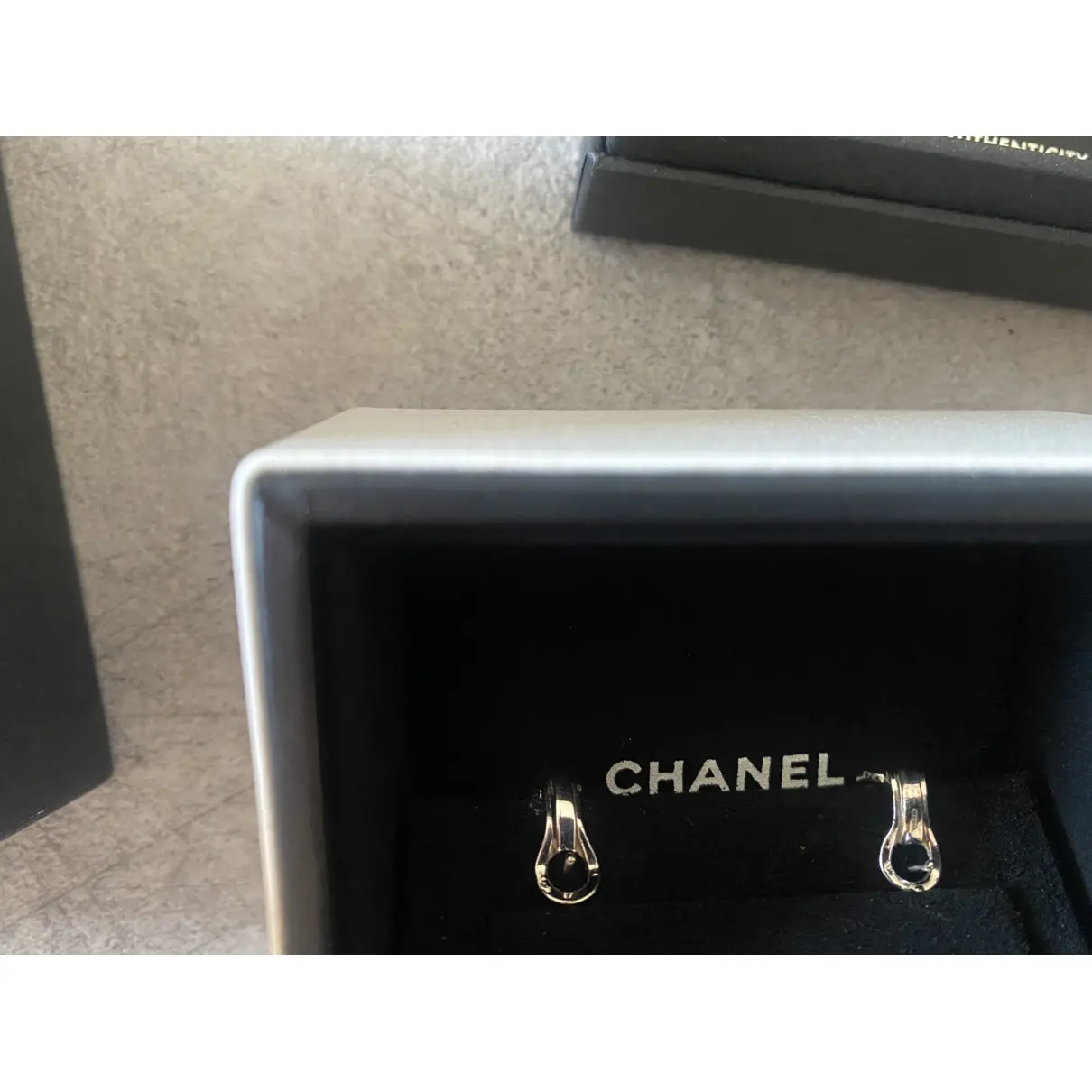 Buy Chanel CC white gold earrings online