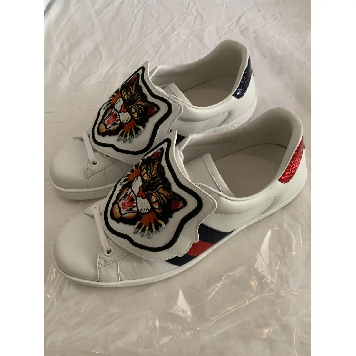 Buy Gucci Ace mongolian lamb trainers online