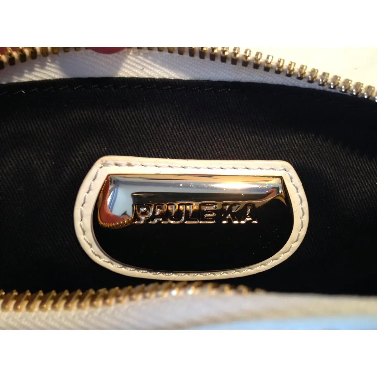Buy Paule Ka Patent leather clutch bag online