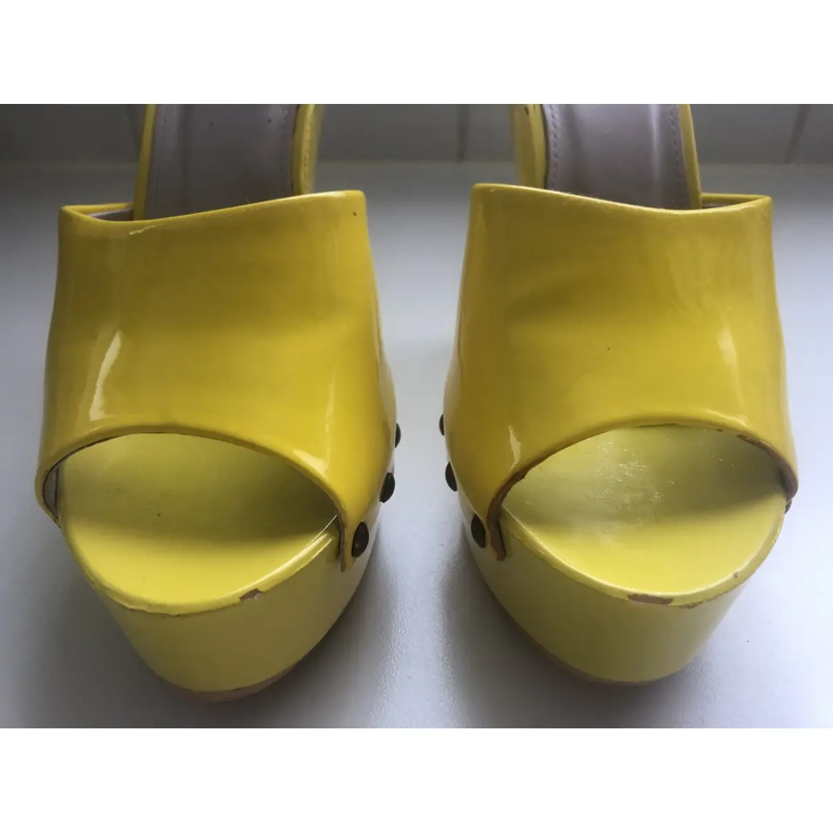 Yellow Plastic Sandals Versus