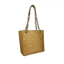 Buy Chanel Petite Shopping Tote leather tote online - Vintage