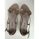 Buy Miu Miu Patent leather sandals online