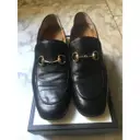 Buy Gucci Brixton leather flats online