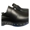 Buy Hermès Calya leather mules & clogs online