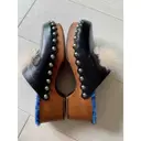 Buy Fendi Leather mules & clogs online