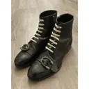 Queercore leather boots Gucci