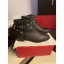 Buy Valentino Garavani Rockstud leather buckled boots online