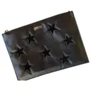 Stella Star leather clutch bag Stella McCartney