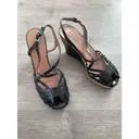 Buy Alaïa Patent leather sandals online